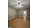 Bedroom with wood floors and light ceiling fan at 3 Elm St, Porterdale, GA 30014