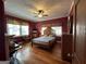 Primary bedroom features hardwood floors, ceiling fan and natural lighting at 3 Elm St, Porterdale, GA 30014