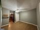 Bedroom featuring wood floors and a view of the home's interior at 3 Elm St, Porterdale, GA 30014