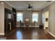 Dining room featuring hardwood floors, fireplace, built in shelves and a ceiling fan at 3 Elm St, Porterdale, GA 30014