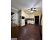 Eat-in kitchen showcasing wood-look flooring, white cabinets and updated appliances at 3 Elm St, Porterdale, GA 30014