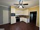 Eat-in kitchen features wood-look flooring, white cabinets and stainless steel appliances at 3 Elm St, Porterdale, GA 30014