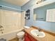 Cozy bathroom with a shower-tub combo, single sink vanity, and a neutral color scheme at 1029 Hines Rd, Moreland, GA 30259
