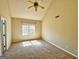 Inviting bedroom with vaulted ceilings, neutral paint, and a ceiling fan offers a relaxing space at 1029 Hines Rd, Moreland, GA 30259