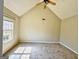 Serene bedroom with vaulted ceilings, plush carpeting, and a large window providing ample natural light at 1029 Hines Rd, Moreland, GA 30259