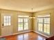 Bright dining area with a modern chandelier and large windows offering plenty of natural light and a great view at 1029 Hines Rd, Moreland, GA 30259