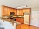 Functional kitchen features wooden cabinets, modern appliances, and a breakfast bar, perfect for casual dining at 1029 Hines Rd, Moreland, GA 30259