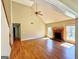 Bright living room with high ceilings, a warm fireplace, and gleaming hardwood floors offers inviting space at 1029 Hines Rd, Moreland, GA 30259