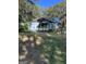 Charming single story house with blue siding and front porch with bright yellow door at 1150 Mayland Sw Cir, Atlanta, GA 30310