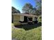 Damaged home's rear exterior showing missing siding and exposed framework at 1150 Mayland Sw Cir, Atlanta, GA 30310