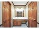 Bathroom with double doors and a vanity with a sink, offering a functional space at 105 Jasper Dr, Stockbridge, GA 30281