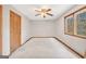 Bedroom featuring neutral walls, wood trim, and natural light from the window and one door at 105 Jasper Dr, Stockbridge, GA 30281
