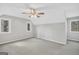 Bright, spacious bedroom with two windows and a ceiling fan offering comfort and ventilation at 105 Jasper Dr, Stockbridge, GA 30281