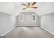 Bedroom featuring a ceiling fan and two windows providing natural light and ventilation at 105 Jasper Dr, Stockbridge, GA 30281