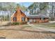 Charming brick home with a welcoming front porch and mature trees at 105 Jasper Dr, Stockbridge, GA 30281