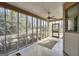 Large screened porch with ceiling fan and views of the yard at 105 Jasper Dr, Stockbridge, GA 30281