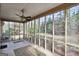 The screen porch has views of the landscaped backyard and the trees beyond at 105 Jasper Dr, Stockbridge, GA 30281
