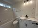 Bathroom featuring a combination tub and shower with a white vanity and black hardware at 349 Lowbrooke Ct # 19, Fairburn, GA 30213