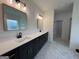 Bathroom with a double sink vanity, tile floors, and modern fixtures at 349 Lowbrooke Ct # 19, Fairburn, GA 30213