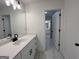 Bright bathroom featuring a white vanity, modern sink and marble patterned flooring at 349 Lowbrooke Ct # 19, Fairburn, GA 30213