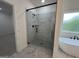 Bathroom featuring a glass-enclosed shower with modern fixtures and marble-look tile flooring at 349 Lowbrooke Ct # 19, Fairburn, GA 30213
