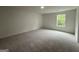Bright bedroom with a window bringing in natural light and a soft carpet at 349 Lowbrooke Ct # 19, Fairburn, GA 30213