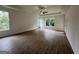 Spacious bedroom featuring hardwood floors, ample natural light, and a modern ceiling fan at 349 Lowbrooke Ct # 19, Fairburn, GA 30213