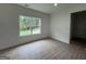 A bright room featuring a large window overlooking the backyard at 349 Lowbrooke Ct # 19, Fairburn, GA 30213