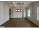 Open dining room featuring modern lighting and wainscoting at 349 Lowbrooke Ct # 19, Fairburn, GA 30213