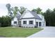 Side view of a stylish two-story house featuring an attached garage and a well-kept lawn at 349 Lowbrooke Ct # 19, Fairburn, GA 30213