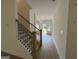 Hallway with wooden staircase and wood floors at 349 Lowbrooke Ct # 19, Fairburn, GA 30213