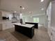 Spacious modern kitchen with two islands, stainless steel appliances, and white cabinetry at 349 Lowbrooke Ct # 19, Fairburn, GA 30213