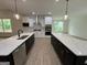 Modern kitchen with stainless steel appliances, dual islands and quartz countertops at 349 Lowbrooke Ct # 19, Fairburn, GA 30213