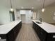 Modern kitchen with two islands, stainless steel appliances and white cabinetry at 349 Lowbrooke Ct # 19, Fairburn, GA 30213