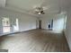Living Room with hardwood floors and natural light from a sliding glass door to the porch at 349 Lowbrooke Ct # 19, Fairburn, GA 30213