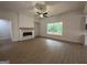 Spacious living room with wood floors, fireplace, and lots of natural light at 349 Lowbrooke Ct # 19, Fairburn, GA 30213