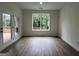 A bright, open room featuring a window and a french door to the backyard deck at 349 Lowbrooke Ct # 19, Fairburn, GA 30213