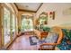 Inviting foyer with tile floors, a colorful floral accent wall, and a stained-glass window at 127 Hamby Ln, Social Circle, GA 30025