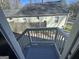 View of back yard from back porch with gray painted steps and white rails at 1457 Richland Sw Rd, Atlanta, GA 30310
