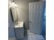 Bathroom with a white sink vanity with a mirror on the wall, and a tile floor at 1457 Richland Sw Rd, Atlanta, GA 30310