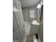 Bright bathroom featuring a tiled shower/tub, large mirror and neutral color scheme at 1457 Richland Sw Rd, Atlanta, GA 30310