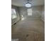 Bright bedroom with neutral carpet, windows providing natural light, and a decorative ceiling fan at 1457 Richland Sw Rd, Atlanta, GA 30310