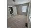 This bedroom is roomy, has carpet, and has two windows that allow for great natural light at 1457 Richland Sw Rd, Atlanta, GA 30310