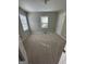 This bedroom is roomy, has carpet, and has two windows that allow for great natural light at 1457 Richland Sw Rd, Atlanta, GA 30310
