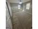 Spacious bedroom featuring neutral carpeting, two windows and a modern ceiling light fixture at 1457 Richland Sw Rd, Atlanta, GA 30310
