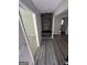 A view of the foyer with wood-look floors, and a built-in wood wall design at 1457 Richland Sw Rd, Atlanta, GA 30310