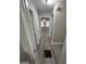 Bright hallway with wood-style flooring leads to a living room with a chandelier at 1457 Richland Sw Rd, Atlanta, GA 30310