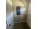 A gray electrical panel sits on the wall of this hallway at 1457 Richland Sw Rd, Atlanta, GA 30310