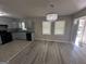 Open floorplan with neutral paint, wood floors and a modern chandelier at 1457 Richland Sw Rd, Atlanta, GA 30310