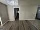 Living room with chandelier, leading to the hallway at 1457 Richland Sw Rd, Atlanta, GA 30310